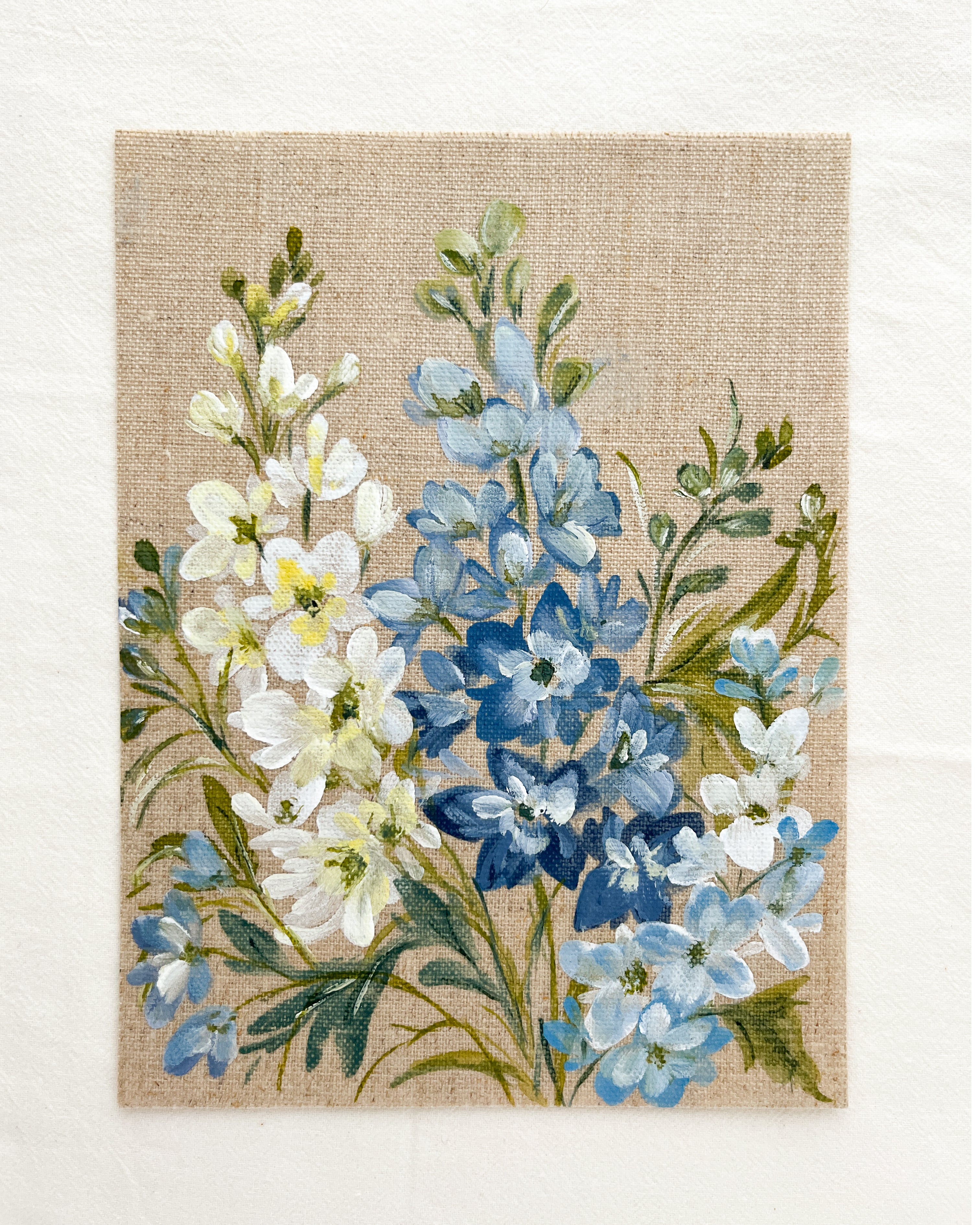 Close-up of Ascending Beauty watercolor by Trisha Patel showing blue and white delphinium flowers, botanical illustration details.