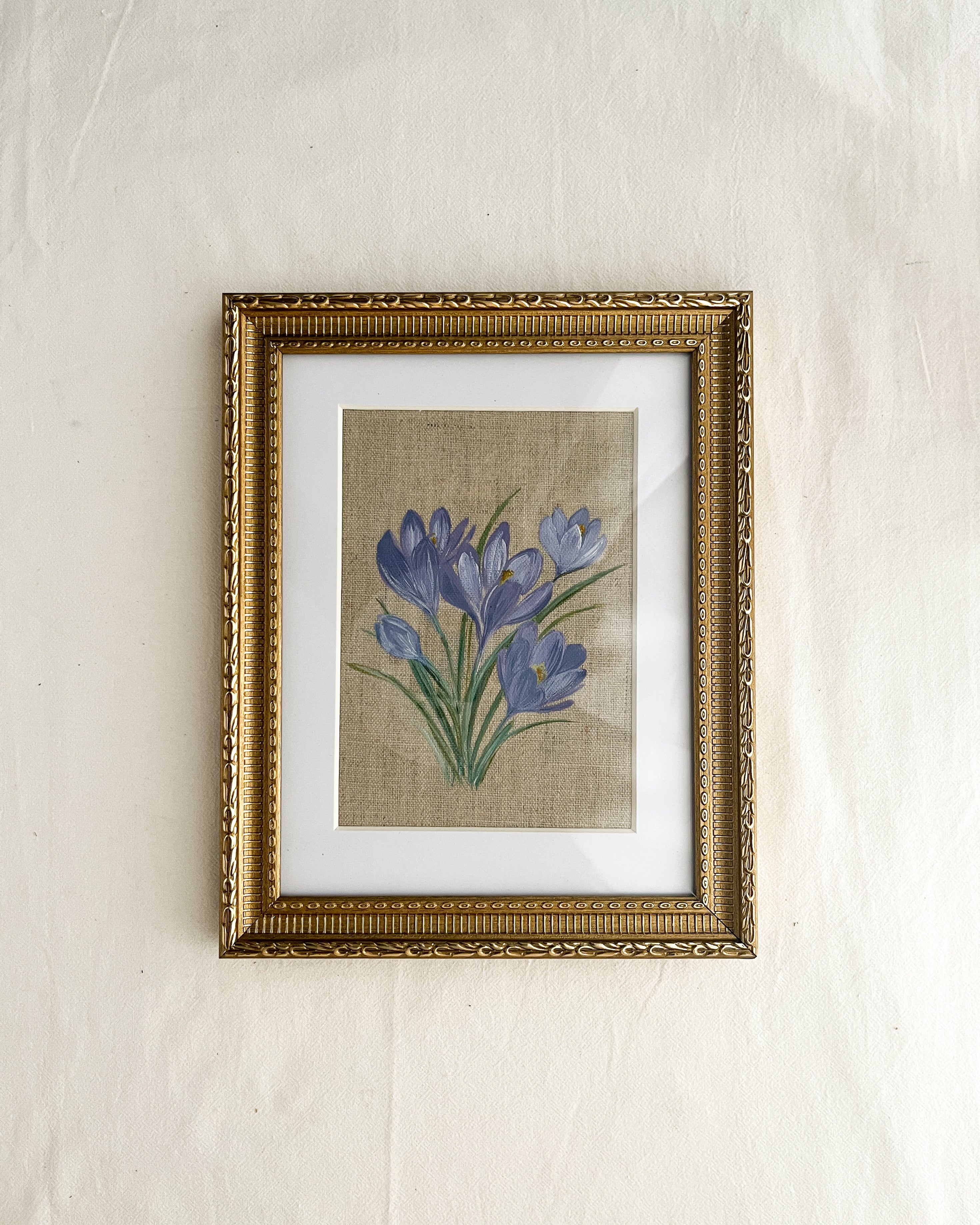 Springs Promise crocus watercolor art by Trisha Patel shown in classic rectangular gold-toned wooden frame with vintage floral embossed border