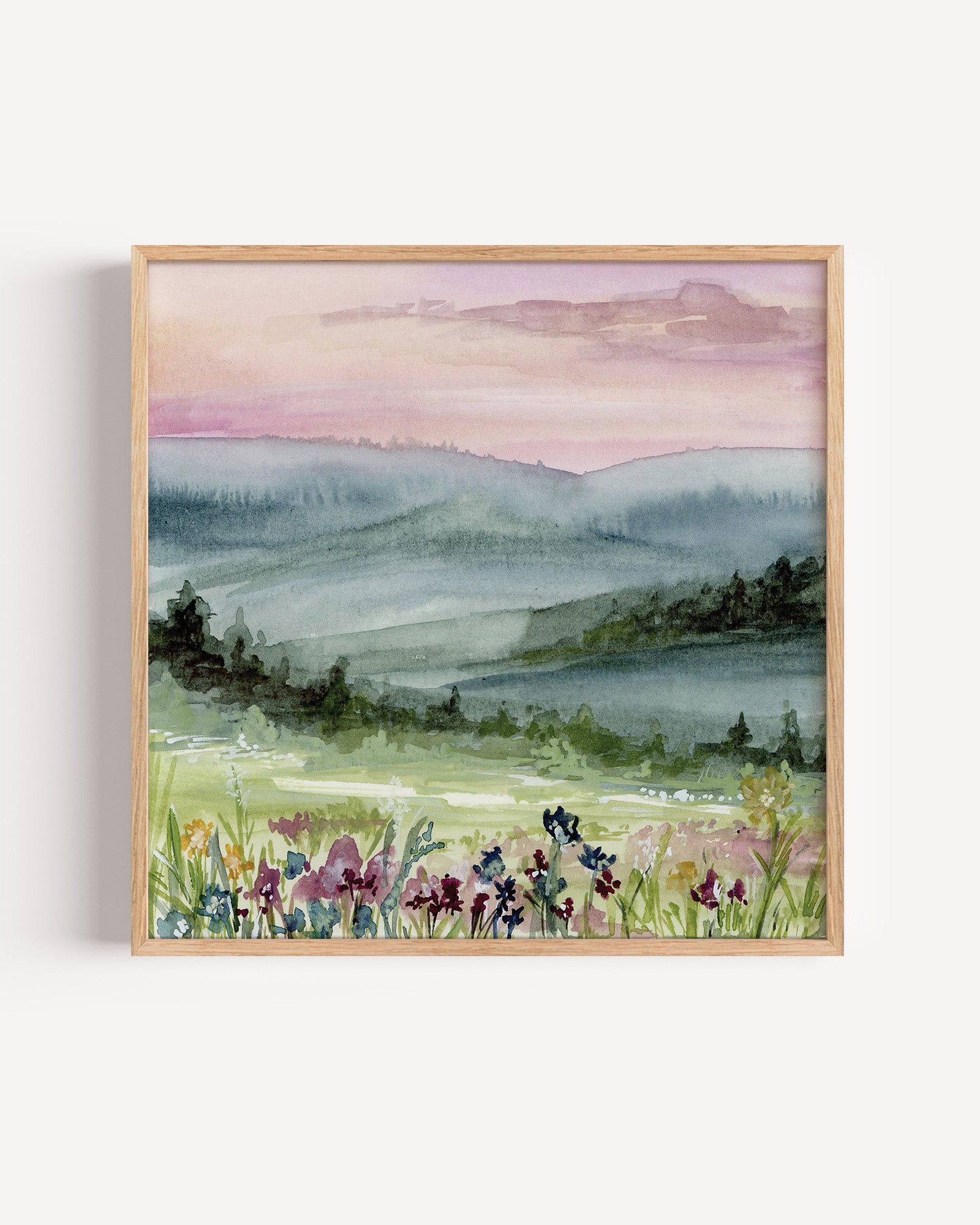 Framed print of Serene watercolor landscape with soft pink and purple dawn sky reflecting on calm water with silhouetted trees