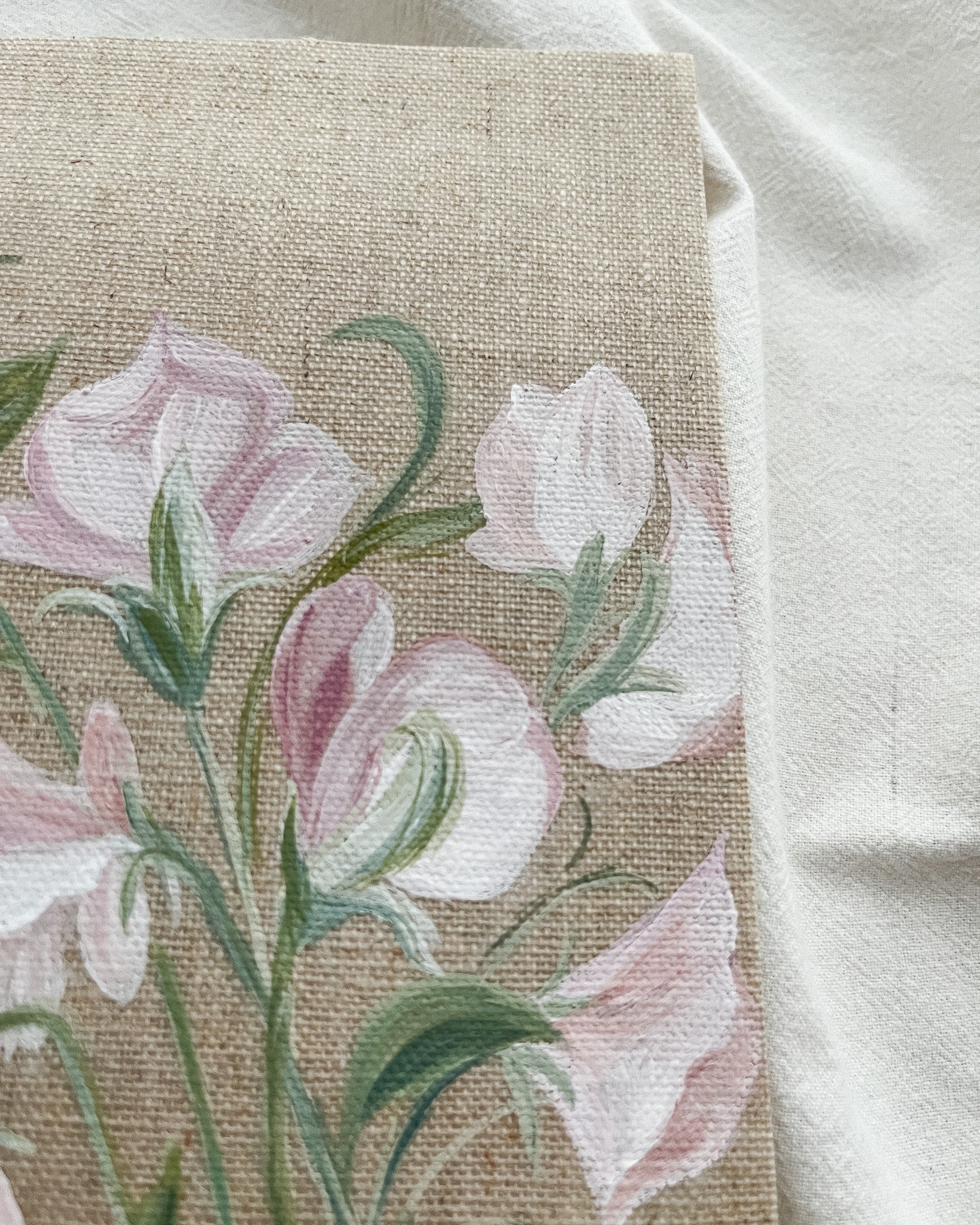 Close-up of sweet pea watercolor painting by artist Trisha Patel showing delicate petals and fine brushwork.