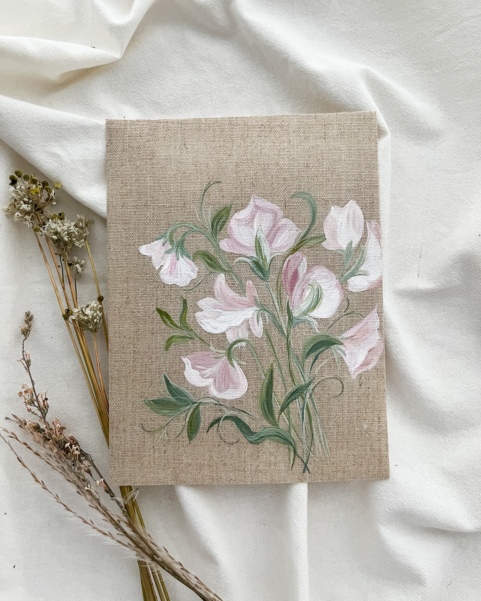 Original watercolor painting of sweet pea flowers by artist Trisha Patel, symbolizing gratitude, kindness, and emotional connection. Botanical art representing the healing power of love and nurturing relationships.