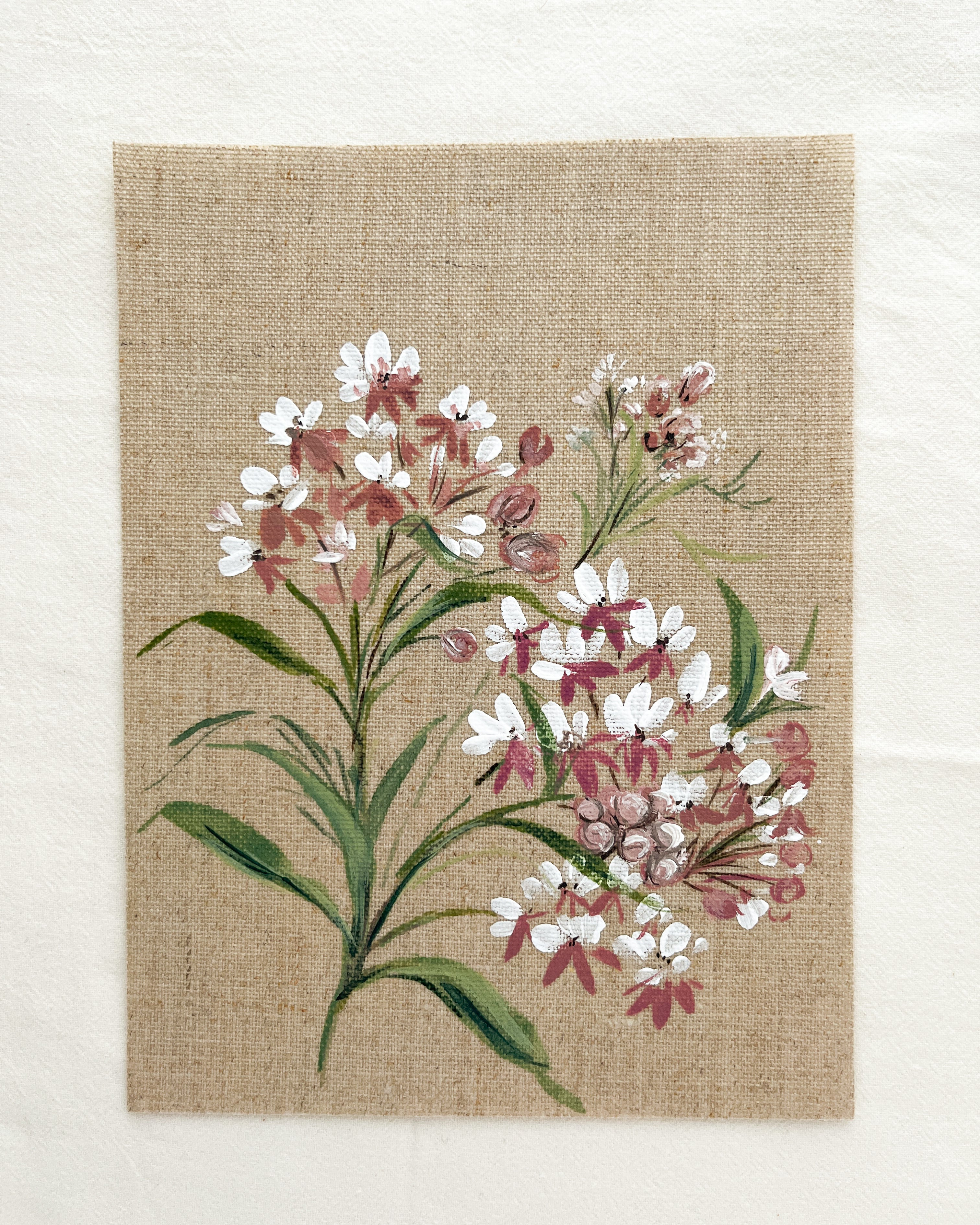 Close-up of Wings of Change Asclepias watercolor painting by artist Trisha Patel, highlighting delicate petals and fine botanical brushwork symbolizing growth and trust in transformation