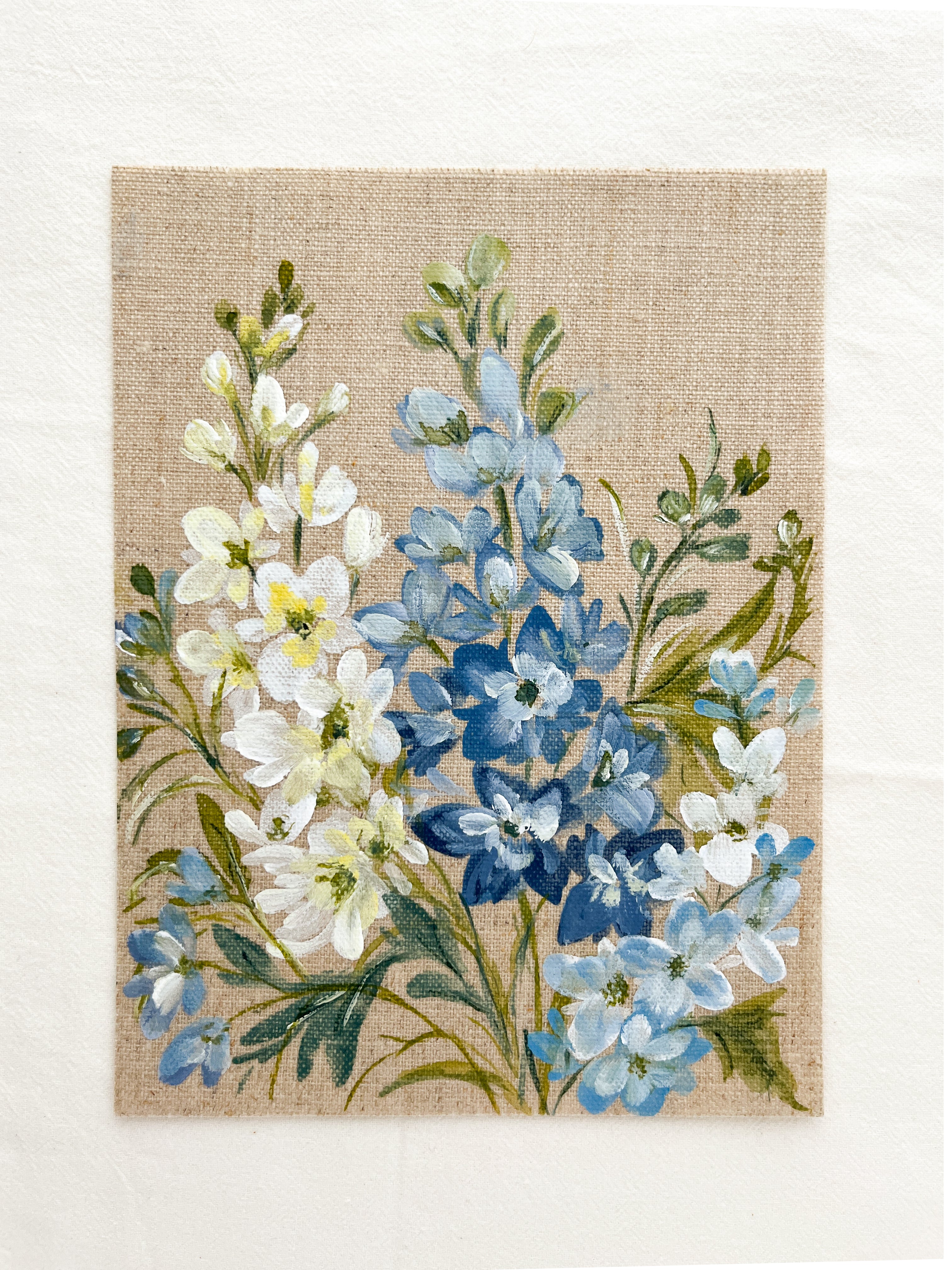Close-up of Ascending Beauty watercolor by Trisha Patel showing blue and white delphinium flowers, botanical illustration details.