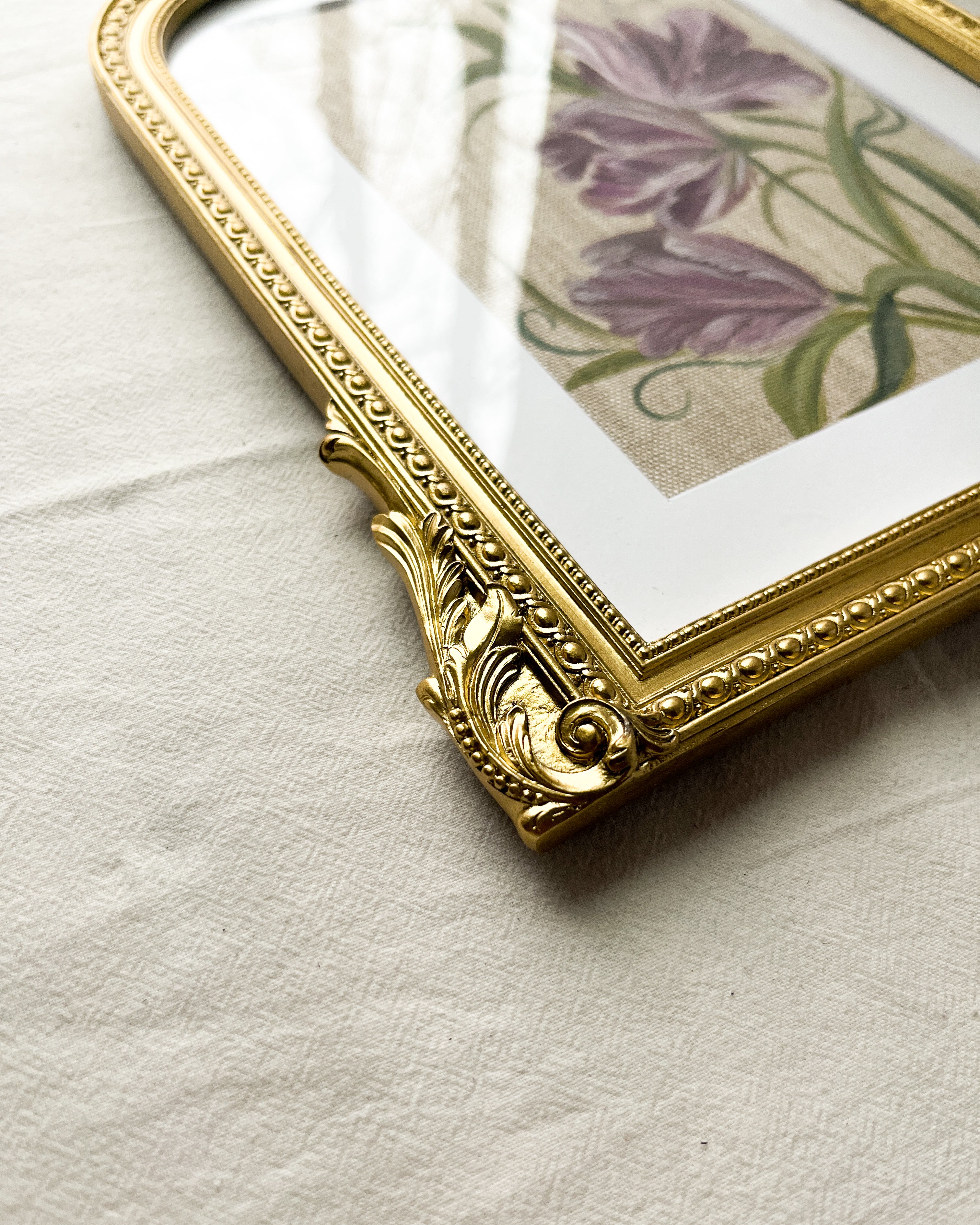 Side angle of Mystic Bloom tulip artwork by Trisha Patel, framed, highlighting gold detailing and arched shape