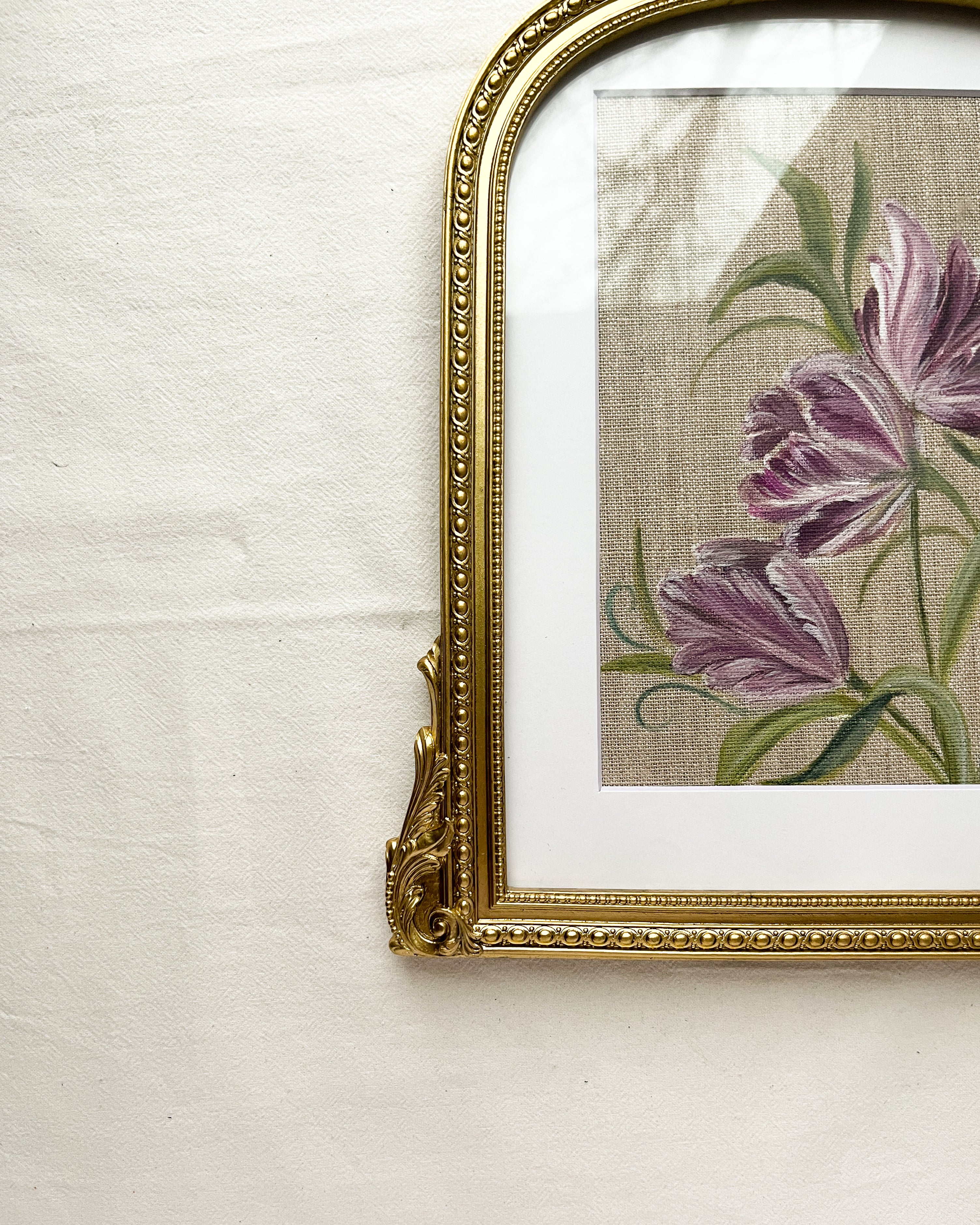 Mystic Bloom by Trisha Patel displayed on a wall, modern home interior décor purple parrot tulip art