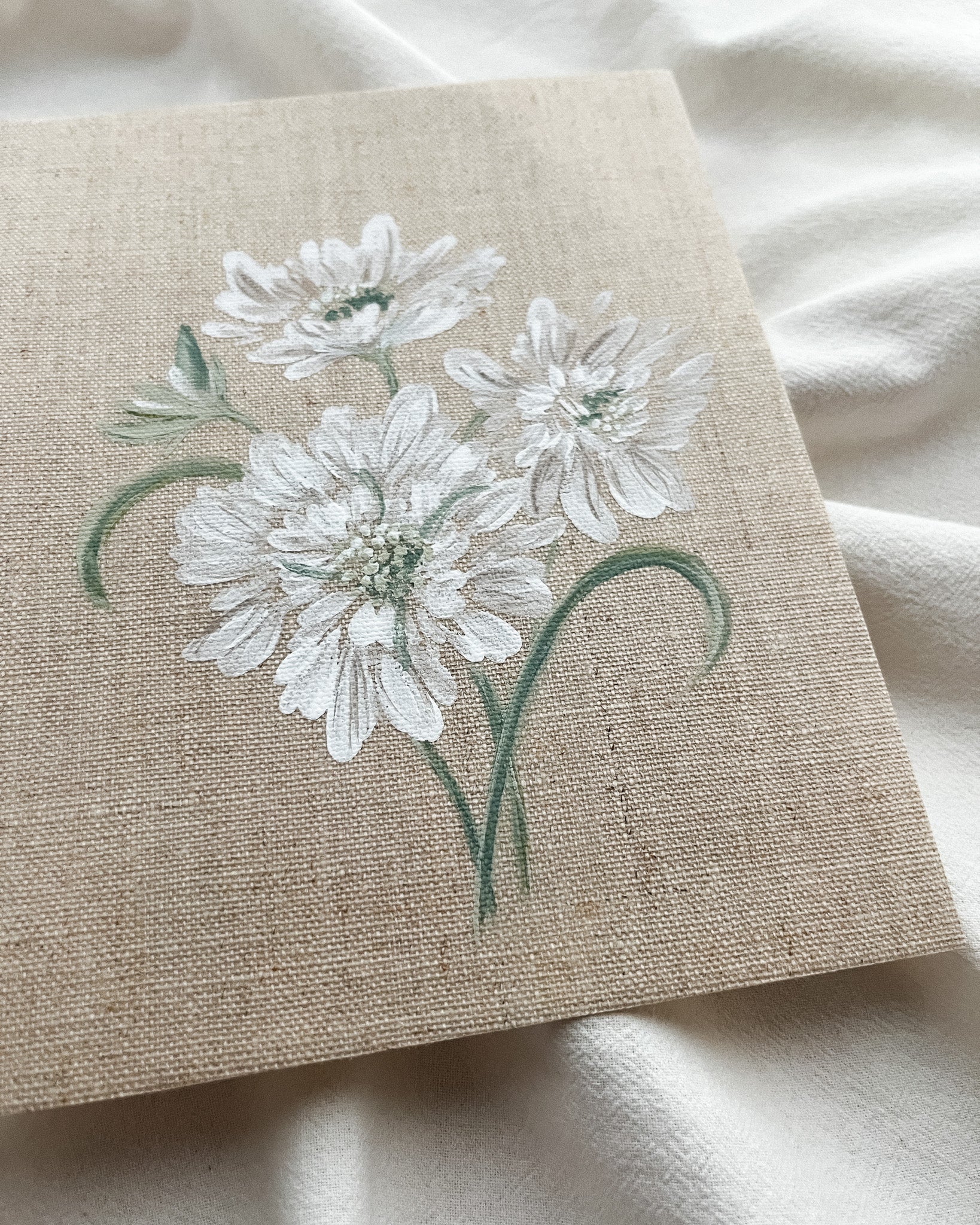 Close-up of 'Reflective Bloom' white scabiosa watercolor painting by Trisha Patel, highlighting delicate white petals and botanical brushwork