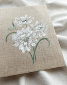 Close-up of 'Reflective Bloom' white scabiosa watercolor painting by Trisha Patel, highlighting delicate white petals and botanical brushwork