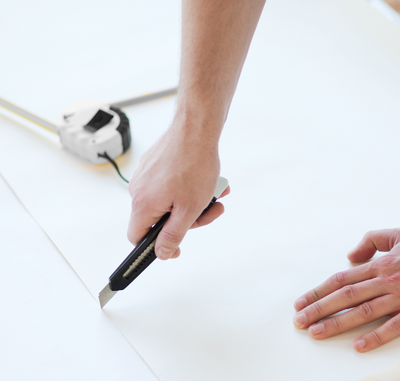 Change your knife blade often so cuts along ceilings, baseboards, and corners stay clean and don’t tear the paper