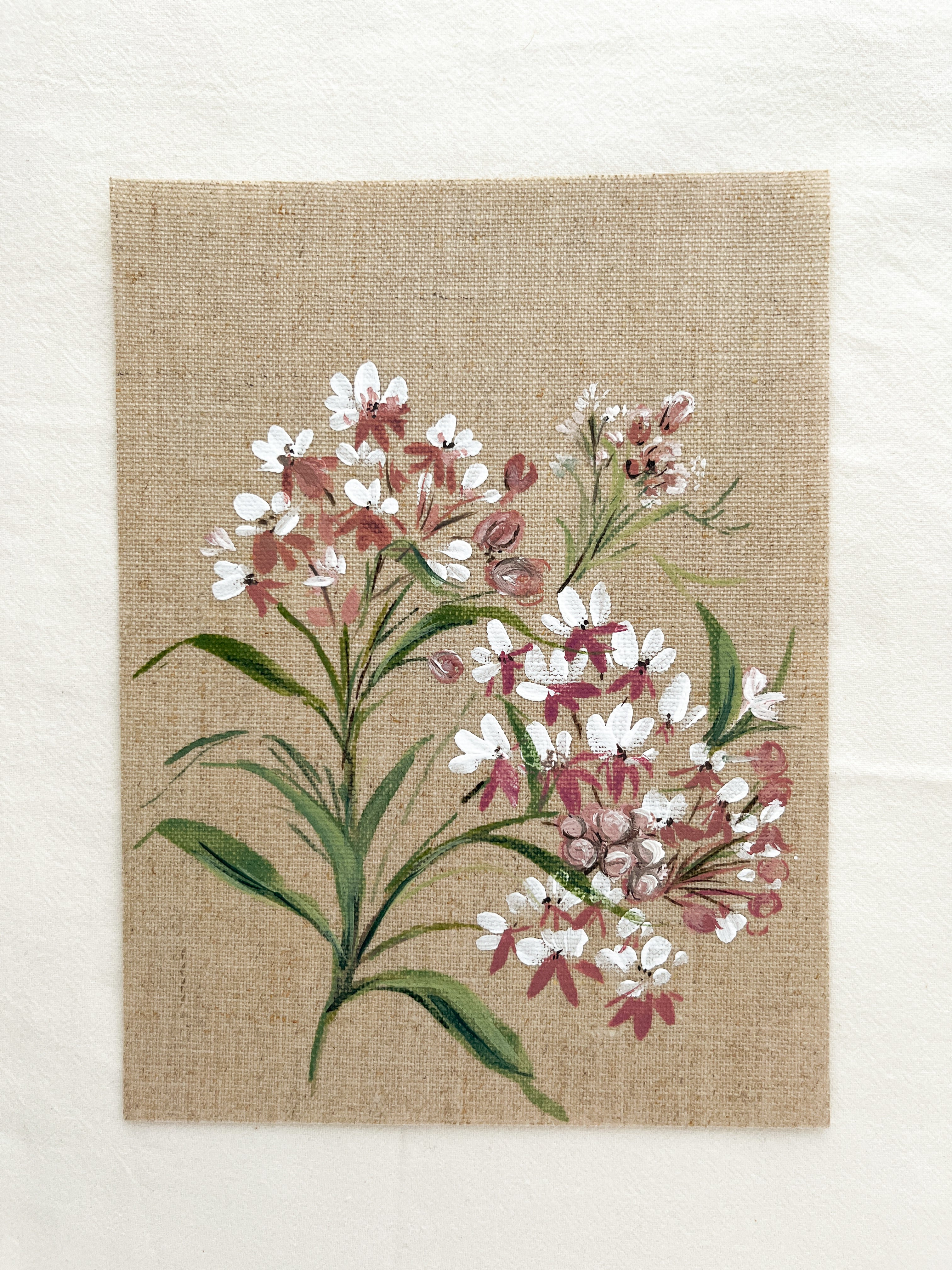 Close-up of Wings of Change Asclepias watercolor painting by artist Trisha Patel, highlighting delicate petals and fine botanical brushwork symbolizing growth and trust in transformation