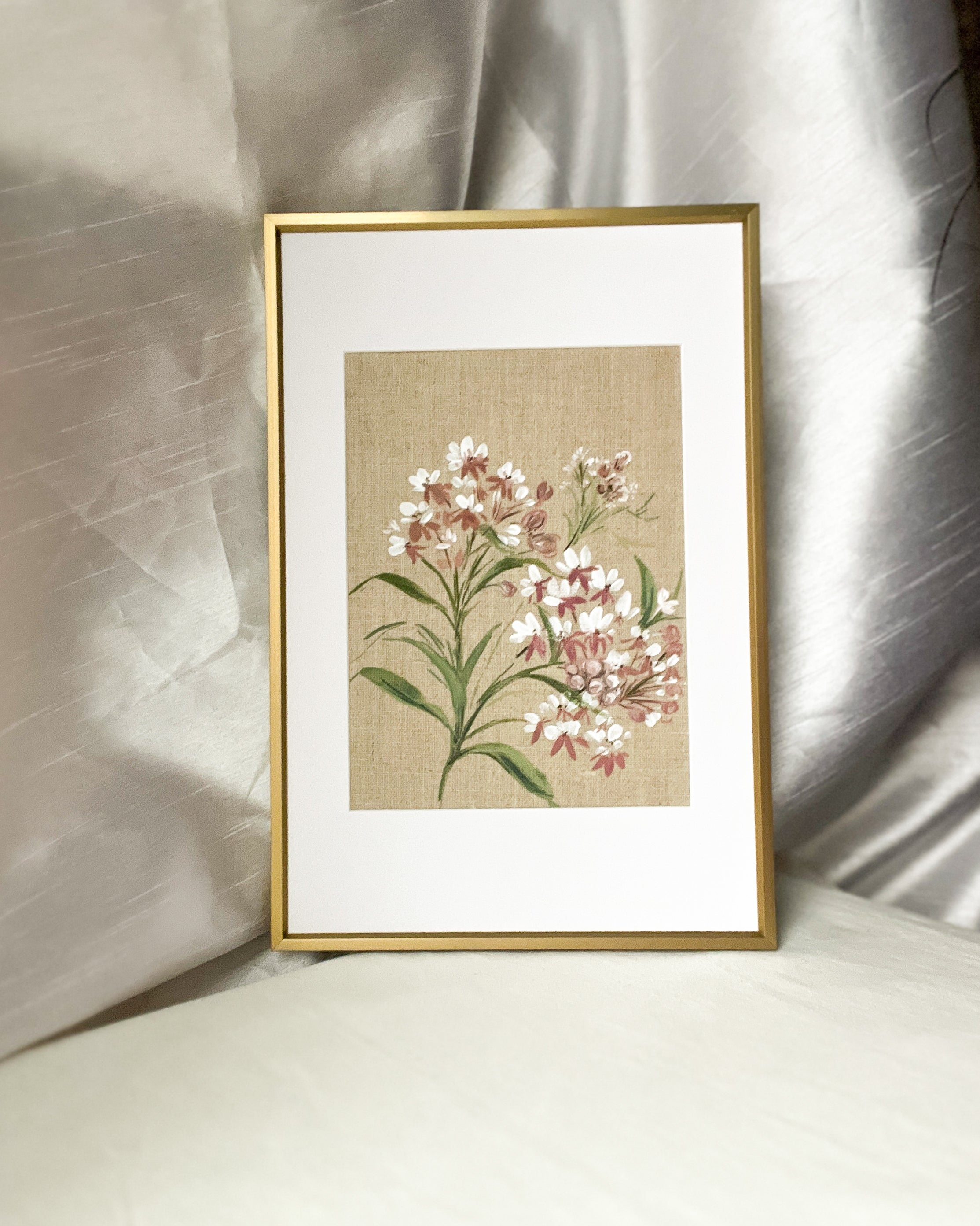 Wings of Change botanical watercolor art by Trisha Patel displayed in sleek gold metal frame with durable glass, modern wall décor symbolizing renewal and resilience